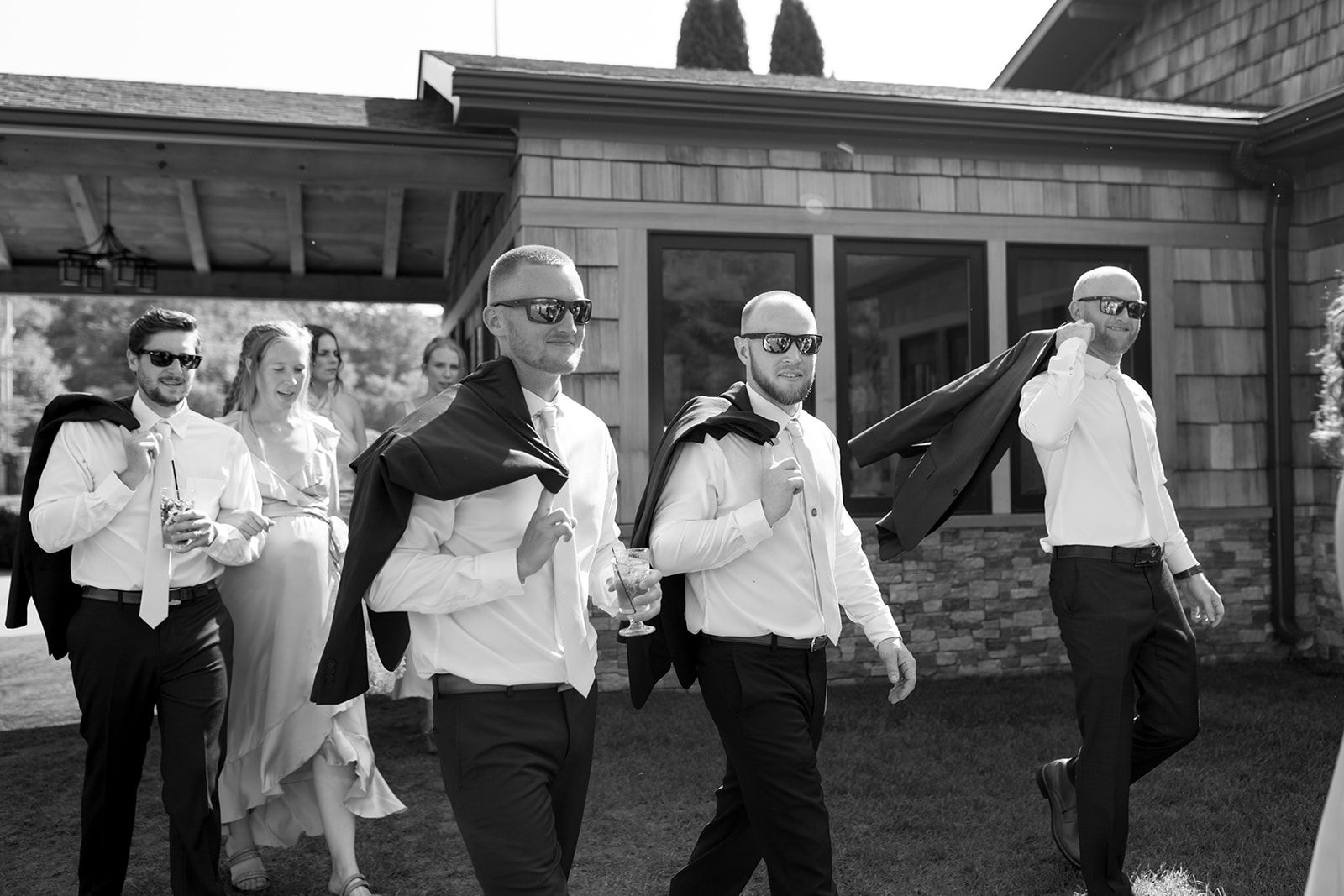 Groomsmen walking to reception